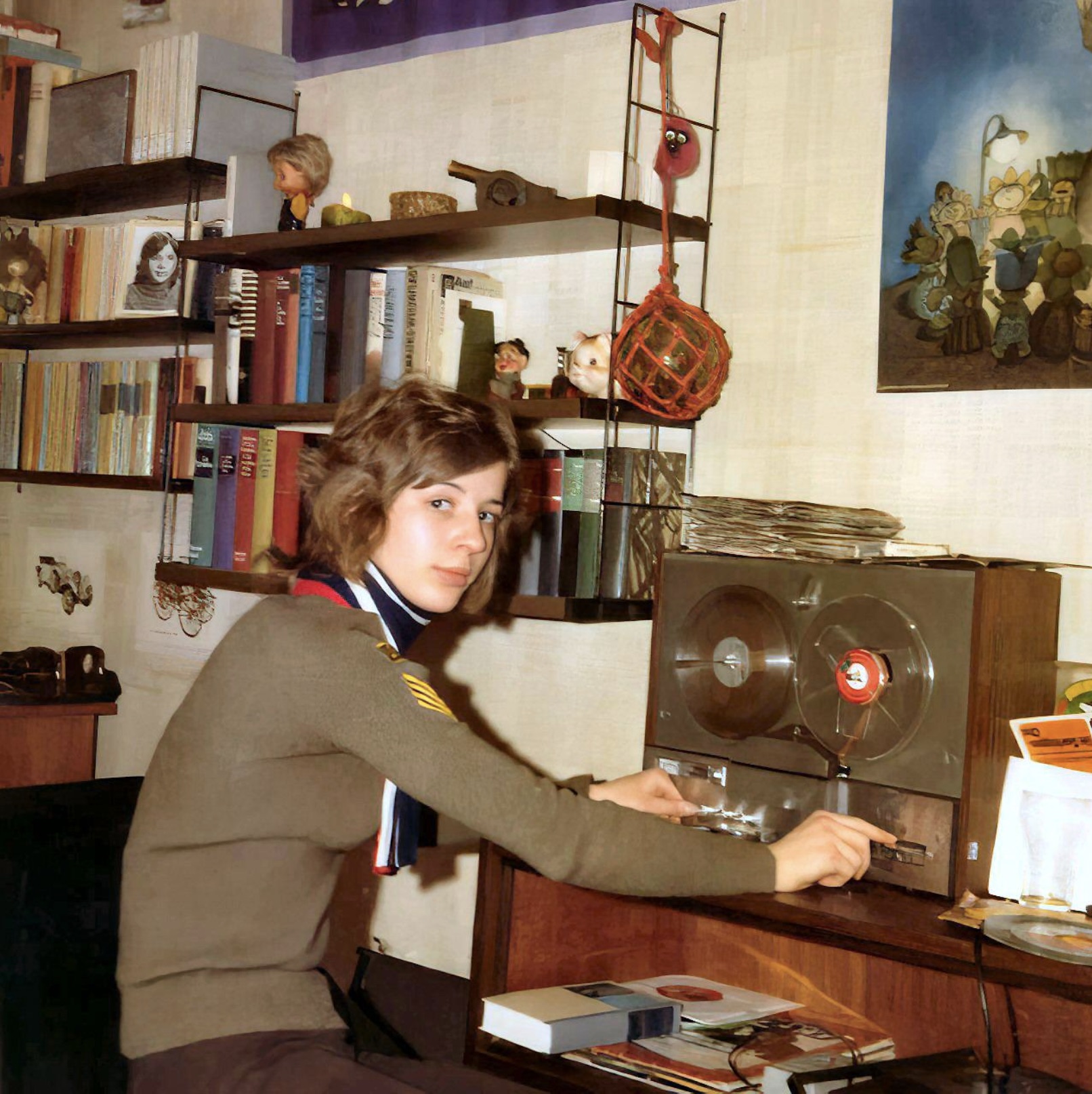 Teenager showing her reel to reel tape machine. Early 1970s.